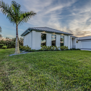 house with green lawn